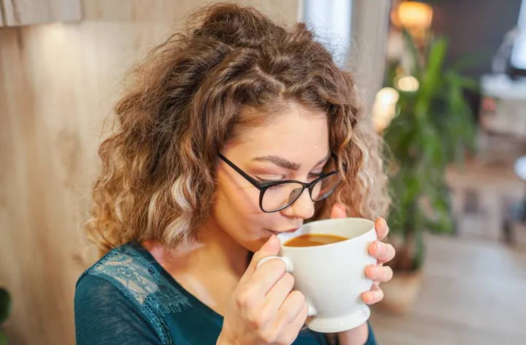 Loving Drinking Coffee? Here's The 1 Thing You Definitely Shouldn't Do, According To A Dentist