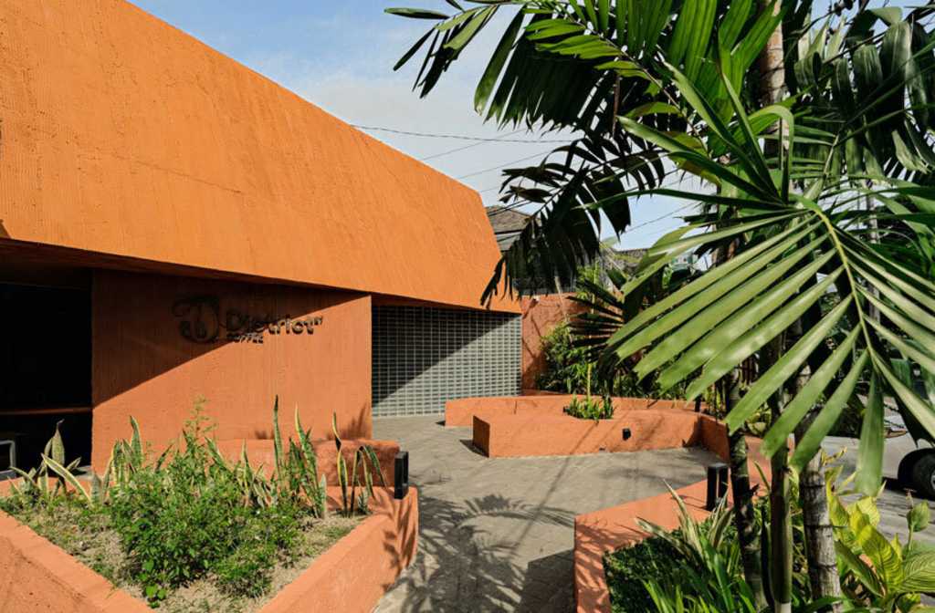 terracotta-tinted concrete district 27 coffee shop reuses old medical laboratory in indonesia