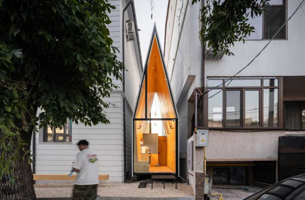 Meet “The Chapel,” A Tiny Glowing Coffee Prism In Bucharest
